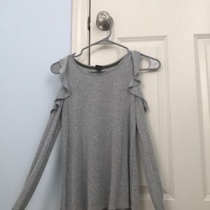 Ling sleeved shirt with an open shoulder area